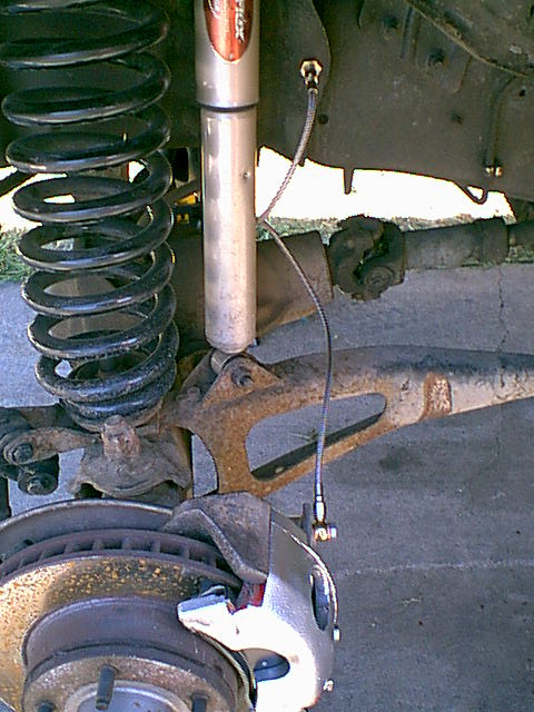 1983 Ford Bronco - I put the caliper back on and installed the line