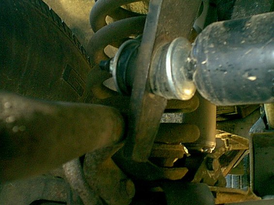 Here is the issue when the wieght is on the wheels. this is bending the shock mount and locking around the swaybar. no good how ever you look at it.