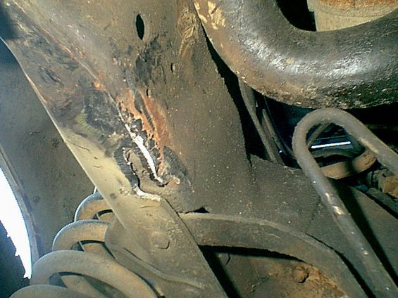 here is the frame where the mount tore off of. you can see the 2 holes in the frame i used these with the new mount. Funny thing is the new mount was inthe center box in the bronco.