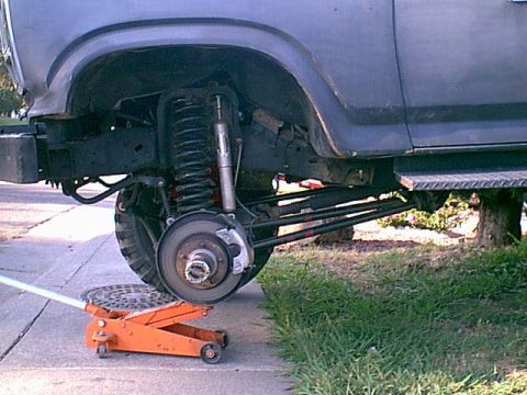 1983 Ford Bronco - Ok the wheel is off. I was lazy here please put a Jack stand under the frame or front axle do not work on the jack as i did. I have had jac…