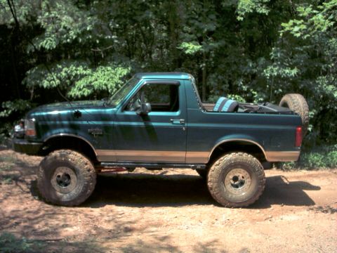 1996 Ford Bronco - This 1996 Ford Bronco is shown in a side profile, equipped with off-road tires and a spare tire mounted on the rear.