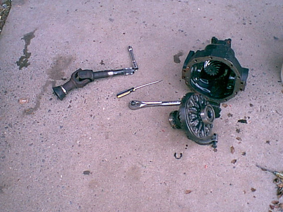 I removed the c-clip and carrier. these are 3.55-1 gears on an open carrier. not what i need so going to the pile of extra parts.
