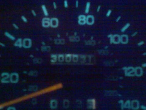 1991 Ford Bronco - The vehicle's odometer reads 30000 miles, with the speedometer needle indicating a speed around 20 mph.