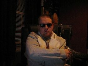 1990 Ford Probe - A person is seen wearing sunglasses and a jacket in a dimly lit indoor setting.