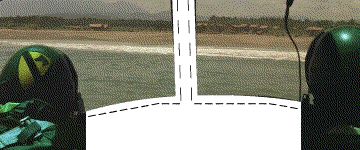 1990 Ford Probe - Looking out at the ocean from inside a vehicle, with a beach and distant buildings visible.