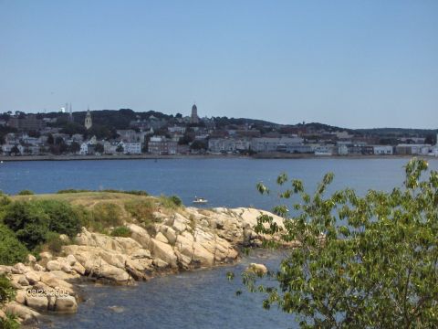 1996 Mercury Grand Marquis - A scenic view of a coastal town with a body of water and rocky shoreline, dated 08/23/2005.
