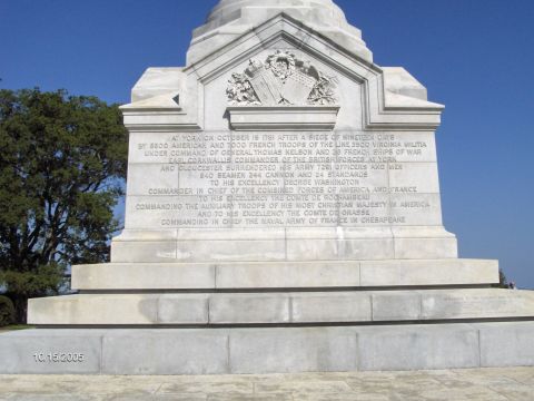 1996 Mercury Grand Marquis - A large stone monument displays an inscription of historical significance, with a date stamp at the bottom.