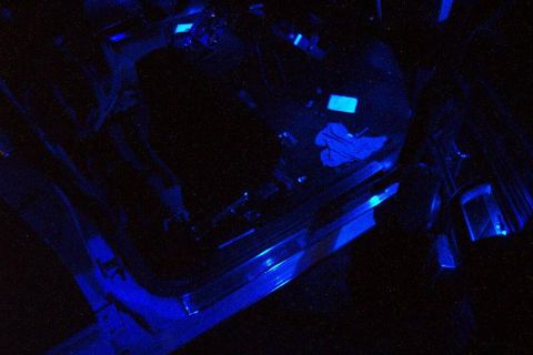1985 Ford Crown Victoria LTD - The interior of a vehicle is illuminated with blue lighting, obscuring specific details.