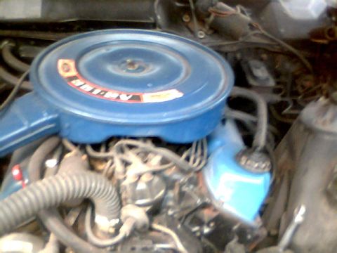 1970 Ford Ranchero - Close-up of an engine bay, a blue air filter housing and various hoses.