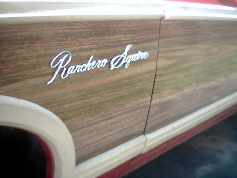 1970 Ford Ranchero - Close-up of the woodgrain side panel and 'Ranchero Squire' emblem on a 1970 Ford Ranchero.