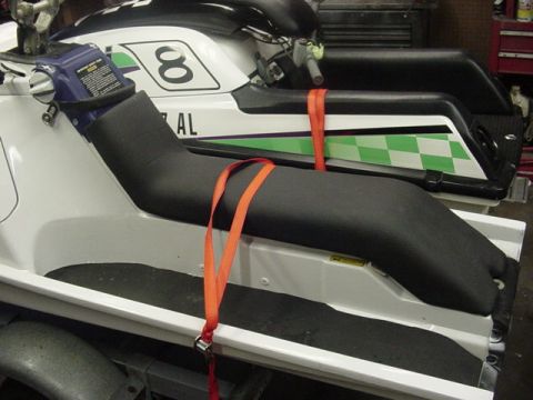 1995 Ford Mustang - Two jet skis are secured on a trailer, ready for transport or storage.