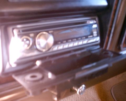 1979 Ford Bronco - Aftermarket car stereo installed in the dashboard of a vehicle.