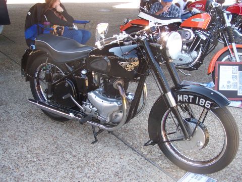 1973 Ford Ranchero - A classic BSA motorcycle is displayed outdoors, with other motorcycles and spectators in the background.