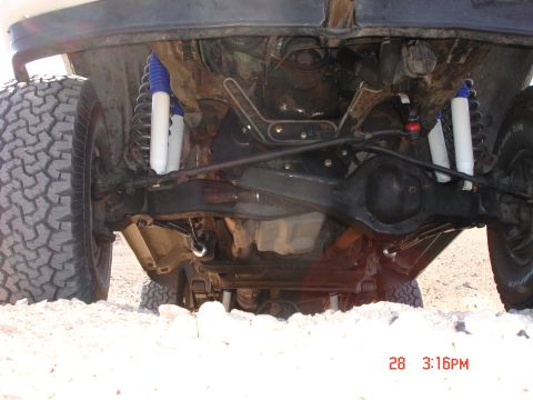 1996 Ford Bronco - The underside of a 1996 Ford Bronco shows its suspension and off-road tires.