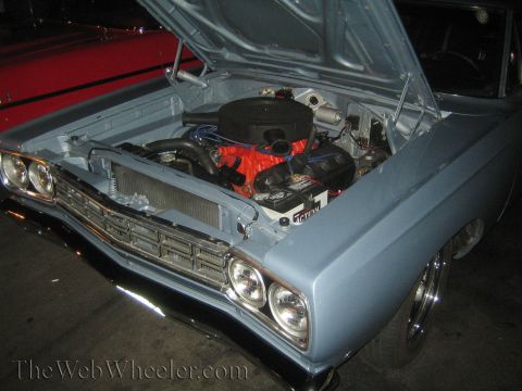 1968 Ford Mustang - Light blue 1969 Plymouth Road Runner engine bay shown with hood raised.