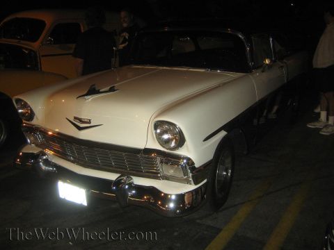 1968 Ford Mustang - A white and black 1956 Chevrolet Bel Air is parked next to another vehicle.