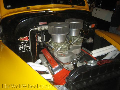 1968 Ford Mustang - Custom engine bay dual carburetors and prominent chrome valve covers.