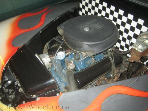 1968 Ford Mustang - Close-up of a customized engine bay flame decals and a checkered flag design.