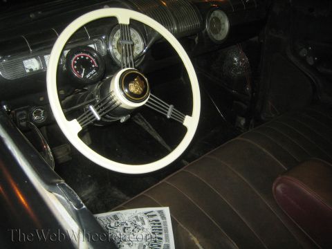 1968 Ford Mustang - Interior view of a classic car, showing the steering wheel, dashboard, and seats.