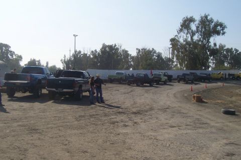 1994 Ford F-150 - A group of trucks are gathered in an outdoor area, possibly for an event or meet-up.