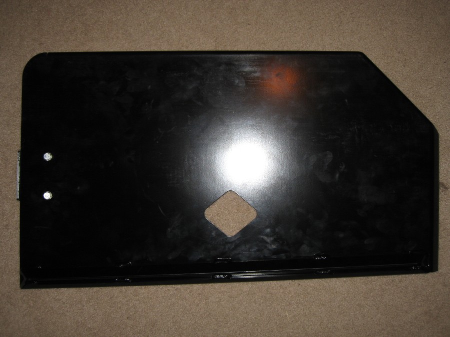 Black metal panel with diamond cutout and two mounting holes