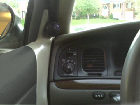 2001 Ford Crown Victoria - Interior view of a 2001 Ford Crown Victoria, highlighting the dashboard and a mounted speaker.