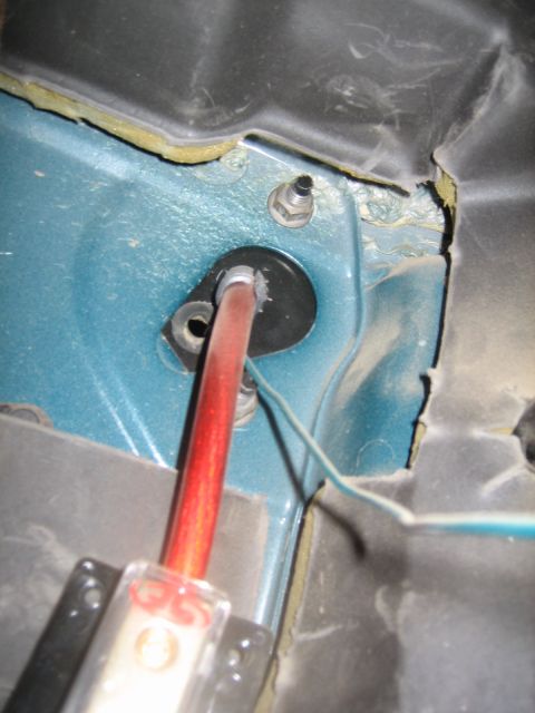 1995 Ford Bronco - Detail of car interior wiring, including a red cable and a SuperMotors watermark.