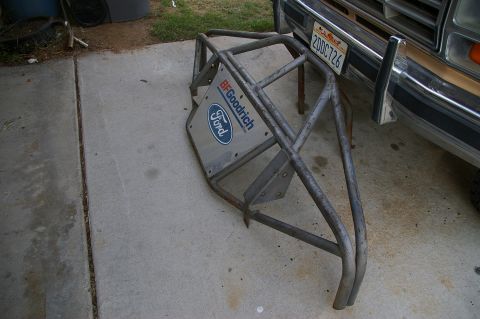 1986 Ford Bronco - A custom pre-runner bumper with Ford and BFGoodrich branding is shown next to a vehicle.