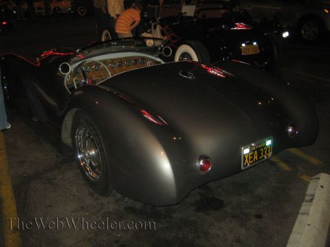 1968 Ford Mustang - Custom roadster with a California license plate parked at night. Another vehicle is visible in the background.