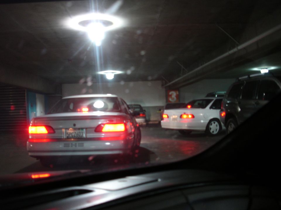 1993 Ford Taurus rear view in a parking garage, with other cars visible