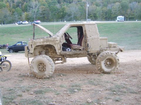 1986 Ford Ranger - This 1986 Ford Ranger is heavily covered in mud, showing its modified suspension and large off-road tires.