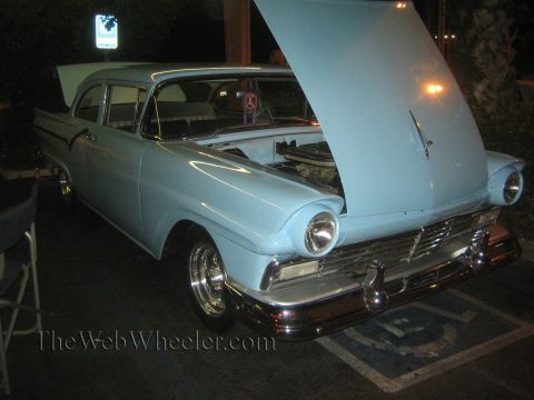 1968 Ford Mustang - This light blue 1957 Ford Fairlane sedan is shown with its hood open, revealing the engine compartment.