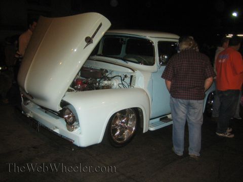 1968 Ford Mustang - This light blue 1956 Ford F-100 pickup truck is displayed with its hood open, revealing the engine compartment.
