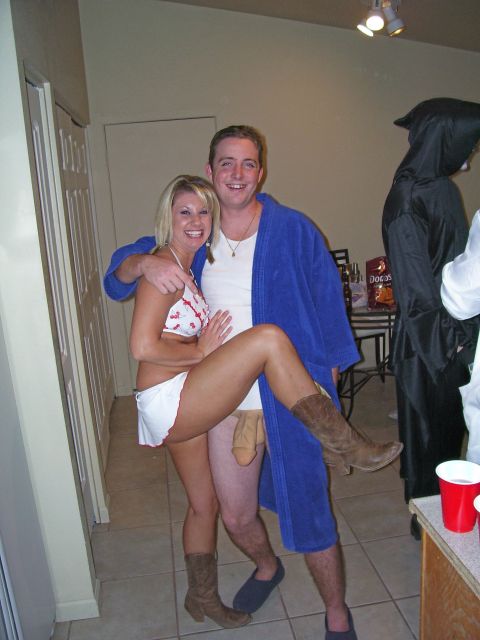 1991 Ford Bronco - A couple poses for a photo during what appears to be a costume party.