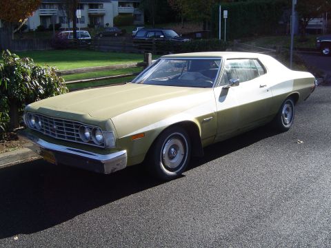 1973 Ford Torino - This 1973 Ford Torino coupe features a distinctive grille and two-tone paint scheme.