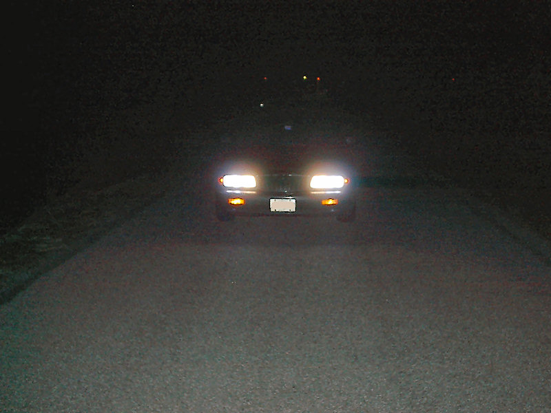 1985 Mercury Grand Marquis front view at night with headlights on