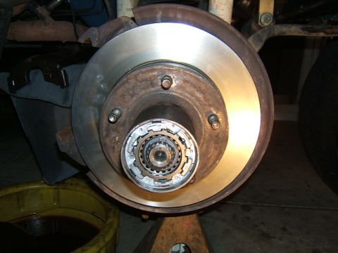 1988 Ford Bronco - This photo shows a vehicle's front wheel hub and brake assembly, likely during maintenance or repair.