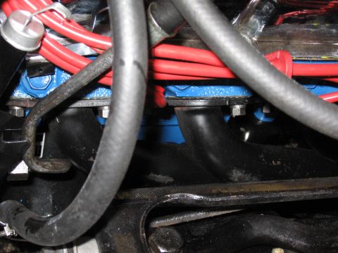 1973 Ford Ranchero - Engine detail showing exhaust pipes and spark plug wires.
