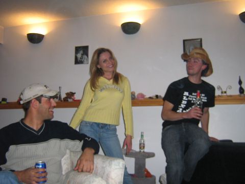 1995 Ford Bronco - Three people are gathered in a room, with two men and one woman present.