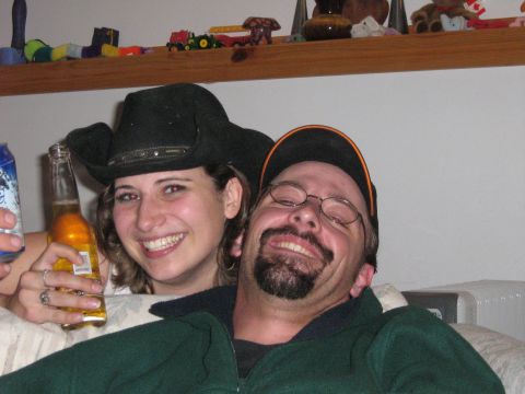 1995 Ford Bronco - Two people are smiling for the camera, one holding a beer and wearing a cowboy hat.