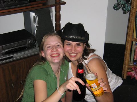 1995 Ford Bronco - Two women pose for a photo while holding beer bottles and smiling.