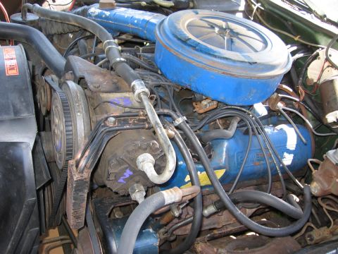 1973 Ford Ranchero - Close-up view of a vehicle's engine bay, highlighting the air cleaner and valve covers.