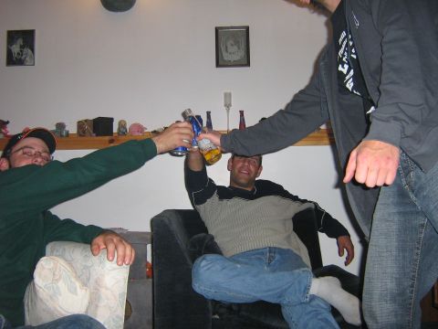 1995 Ford Bronco - Friends gather for a toast with drinks, celebrating a moment together.