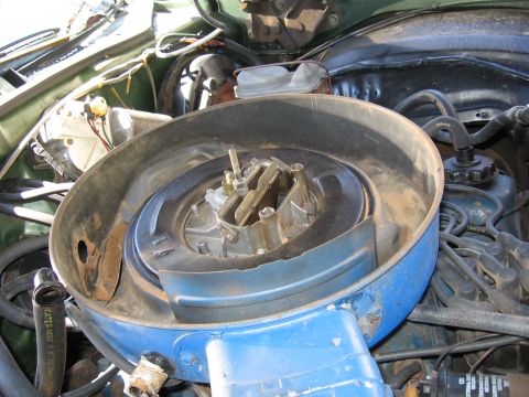 1973 Ford Ranchero - Close-up view of a vehicle's engine bay, focusing on the carburetor and air filter assembly.