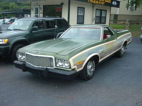 1973 Ford Ranchero - This Ford Ranchero features a unique mural painted along its side, depicting a scenic landscape.