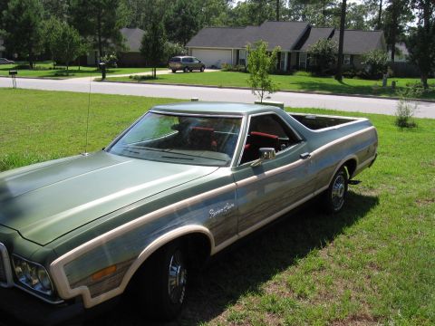 1973 Ford Ranchero - This 1973 Ford Ranchero features distinctive wood paneling along its sides and a green exterior.