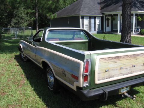 1973 Ford Ranchero - Rear view of a 1973 Ford Ranchero, wood grain paneling on the tailgate and sides.