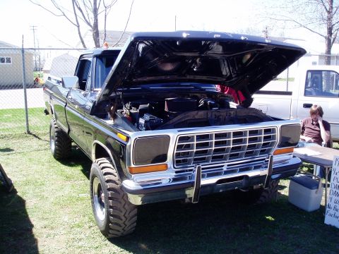 1986 Ford Bronco - This black 1979 Ford F-Series truck has its hood open, revealing the engine bay.