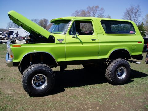 1986 Ford Bronco - This lifted Ford Bronco, likely from the late 1970s, is displayed outdoors with its hood up.