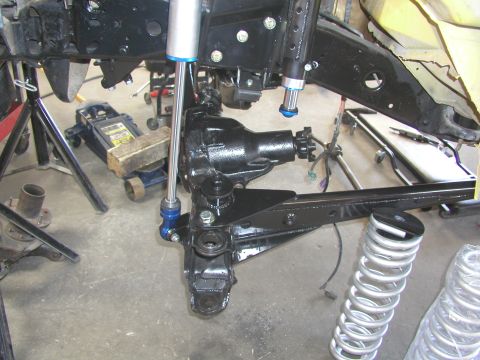 1984 Ford Bronco - Front axle and suspension components are shown, likely during a restoration or modification process.